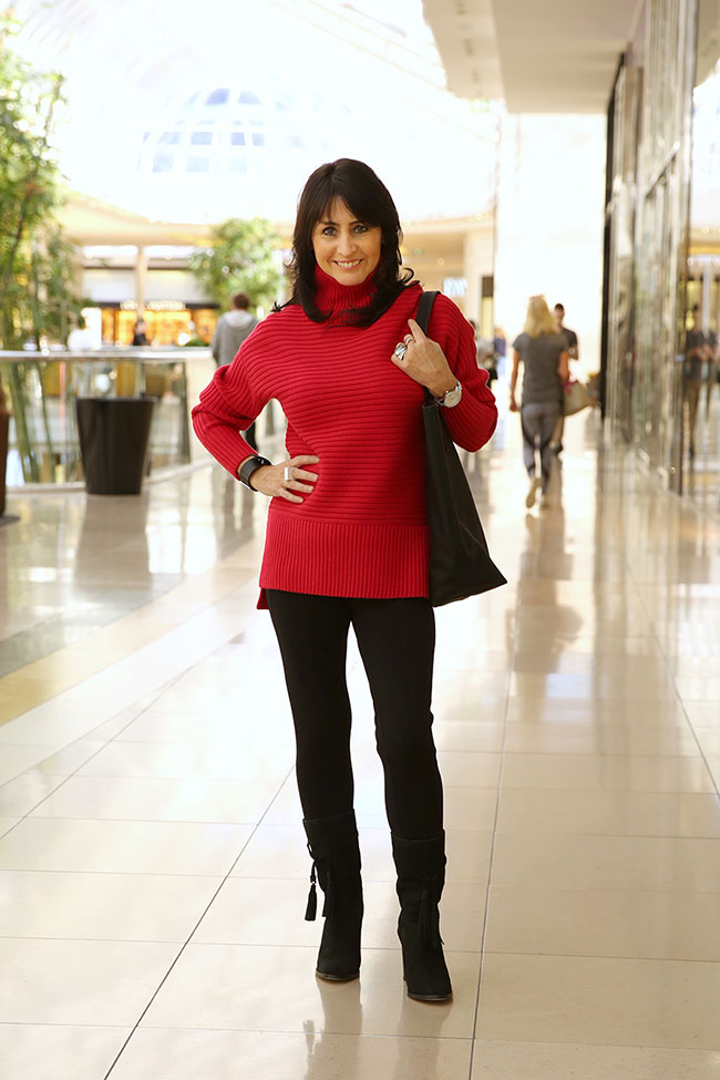 Red jumper $179 with black leggings, tote $119 and long black tassle boots $249